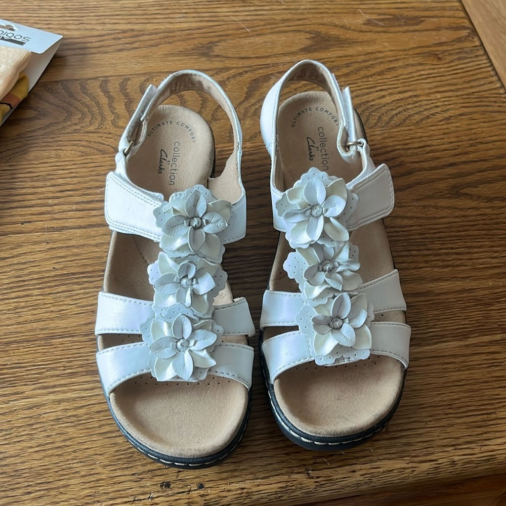 Clark’s white sandals